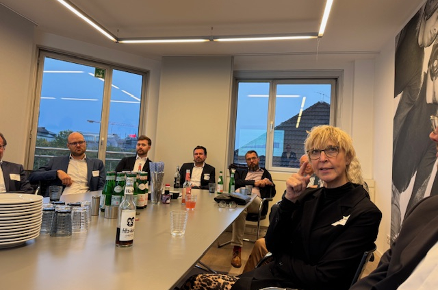 a group of people sitting at a table